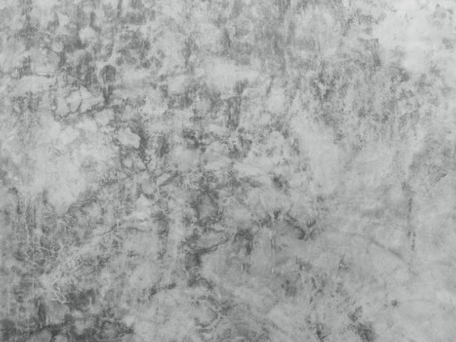 Detalle de hormigón pulido mate con veteado natural gris